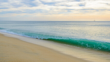 Set of pictures of a fantastic ocean wave in different stages. Cloudy sunrise sky. San Jose del Cabo. Mexico.