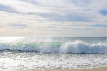 Set of pictures of a fantastic ocean wave in different stages. Cloudy sunrise sky. San Jose del Cabo. Mexico.