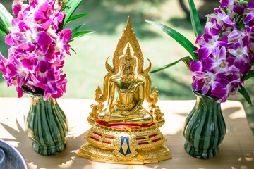 Close-up background Of Buddha images and flowers for ceremonies on auspicious days (New Year, Songkran Festival)