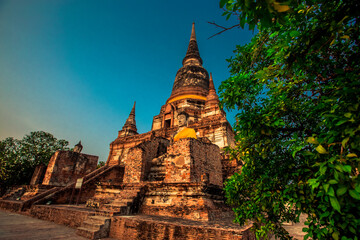 Fototapeta premium Background of old Buddha statues in Thai religious attractions in Ayutthaya Province, allowing tourists to study their history and take public photos.