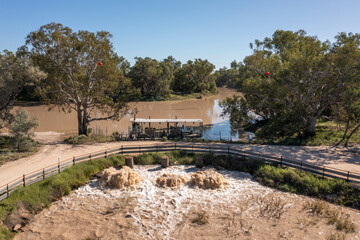 The flooded Darling river in the far outback of New South Wales  with a pumping station filling irrigation canals near Bourke.