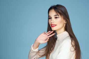 Pretty woman red lips white jacket attractive look close-up blue background