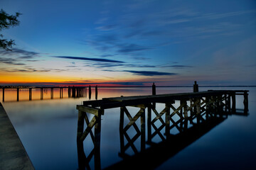 beautiful sunset colors broken down piers