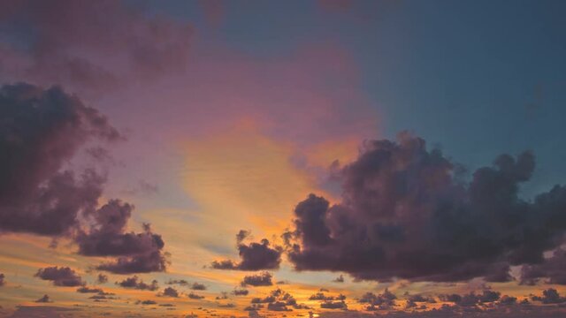 Clouds are moving slowly in the sky during sunset video 4K.Nature video High quality footage Take a video with Blackmagic pocket cinema camera 6K. .Scene of Colorful romantic sky sunset 