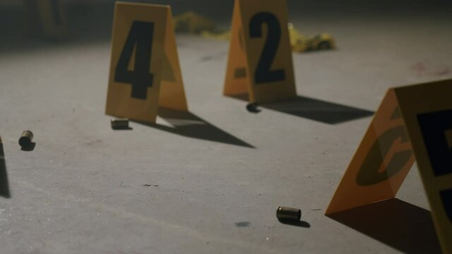 Police Crime Scene with Bullet Casings and Evidence Markers