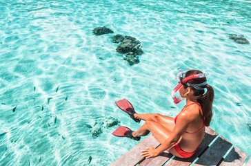 Travel Vacation Snorkeling. Snorkel swim woman going snorkeling in coral reefs for tropical water...