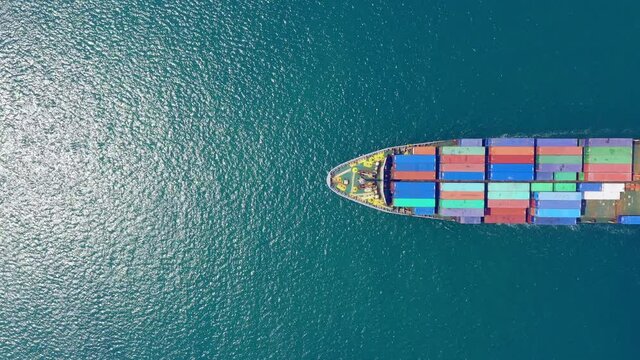 Aerial top view Container carrier ship and business logistic commercial intermodal freight transport in import export, Cargo ship of international travel sea freight around the world. 4K