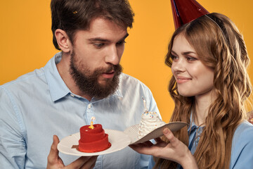 Birthday party man and woman fun yellow background cap holiday