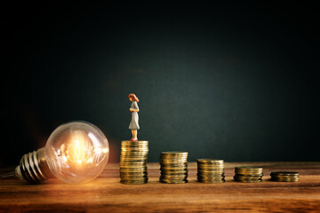 growing stack of coins on wooden table. financial success and managament concept