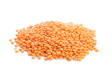 Heap of dry red lentils on white background