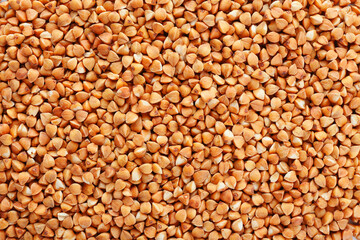Heap of dry roasted buckwheat as background