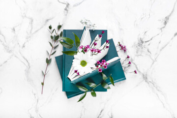 Books with floral decor on white background