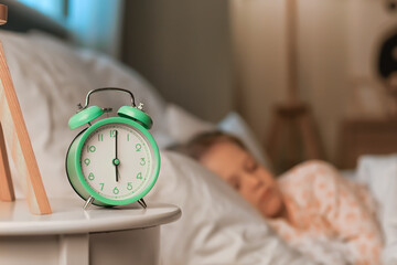 Alarm clock on table in child's bedroom