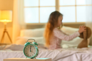 Alarm clock in bedroom of little girl