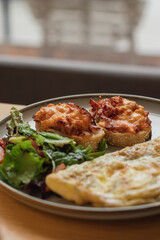 healthy breakfast, lunch or brunch of omelet with avocado, sandwiches and herbs and coffee