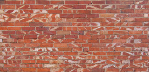 The texture of the wall is made of ordinary red brick. Abstract pattern on the wall.