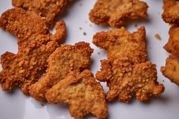 macro closeup of kid's meal dinossaur chicken nuggets snacks