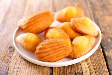 madeleine cake on wood background