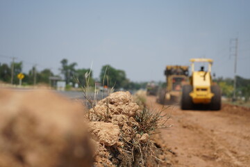 The image is blurred in the construction of asphalt road.