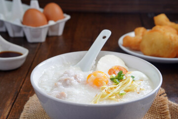 Boiled rice or porridge with pork for breakfast, cooked eggs, Pa