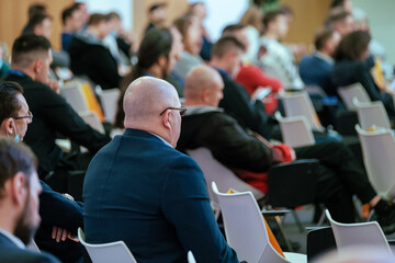 Audience listens to the lecturer at the business conference