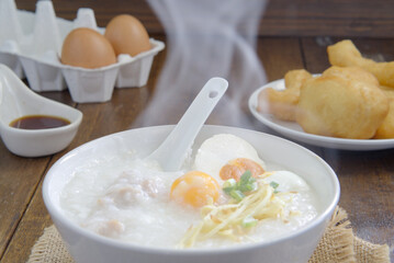 Boiled rice or porridge with pork for breakfast, cooked eggs, Pa