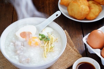 Boiled rice or porridge with pork for breakfast, cooked eggs, Pa