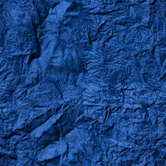 Seamless texture. Abstract blue background. Crumpled blue paper background.Textured backdrop. Paper texture.