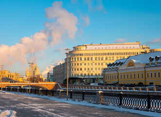 Winter view of snow covered historic Kadashevskaya Embankment along Vodootvodny Canal in center of Moscow on sunny day, Russia