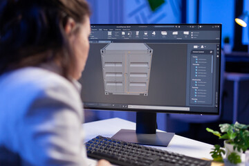Engineer looking at cad software 3D prototype design concept of container working overtime in...