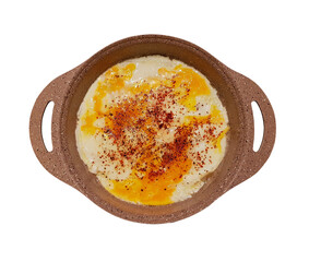 fried egg in a ceramic pan, white background