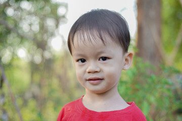 Happy smiling white asian boy