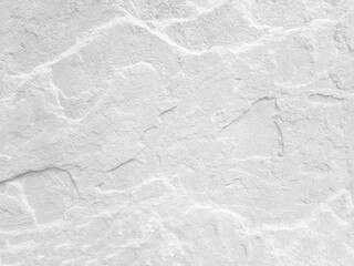 Rough white stone wall background in vintage style for graphic design or wallpaper