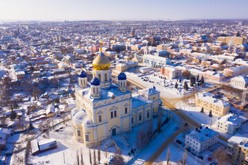 View from drone of Yelets Ascension Cathedral on background with cityscape on sunny winter day, Russia