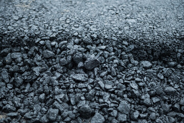 repair of an asphalt road with fresh asphalt
