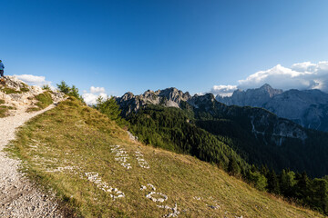 The Julian Alps seen from the Monte Santo di Lussari with the Cima del Cacciatore (Peak of the Hunter) and the mountain range of Jof di Montasio and Jof Fuart. Friuli Venezia Giulia, Italy, Europe.