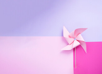 Pink windmill on abstract pink and lilac background