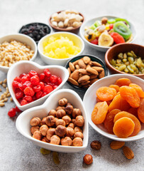 Bowls with various dried fruits and nuts