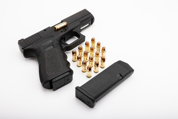 15 rounds bullets magazine and a semi-automatic pistol handgun , Gun law