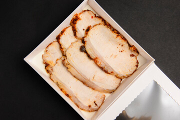 White dish with carpaccio of beef in white delivery box, take away concept.