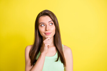 Photo of young attractive lovely happy positive thoughtful minded girl look copyspace thinking isolated on yellow color background