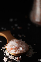 A wooden spoon with pink Himalayan salt