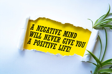 The text A negative mind will never give you a positive life. Motivational quote.