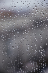Background. Water drops on the glass, window. Blue sky