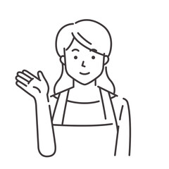 Obraz premium 案内するエプロン姿の若い女性