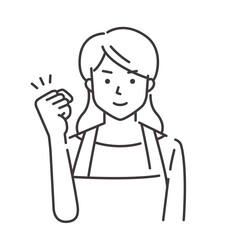 ガッツポーズのエプロン姿の若い女性