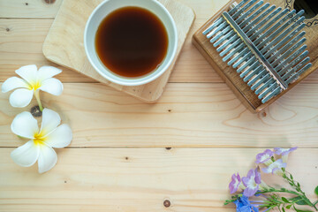 Background concept, Coffee mugs, Kalimba Cactus and small flowers on the wooden floor, start your work day refreshed.