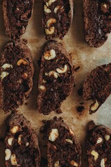 Chocolate chip cookies close-up with hazelnuts . Chocolate cookies with nuts on craft paper....