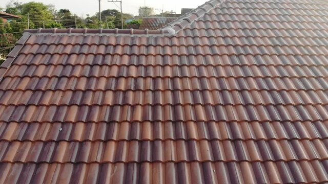 Modern brown roof of new house in suburban architech construction site aerial view