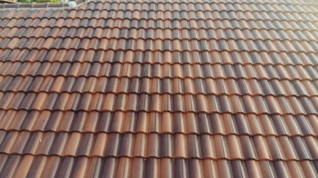 Modern brown roof of new house in suburban architech construction site aerial view